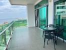 Spacious balcony with outdoor seating and panoramic view