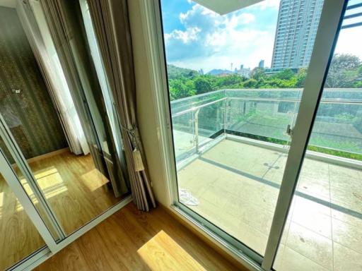 Bright sunny balcony with city view and hardwood flooring