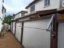 Spacious outdoor patio area of a residential property with privacy walls