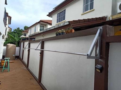 Spacious outdoor patio area of a residential property with privacy walls