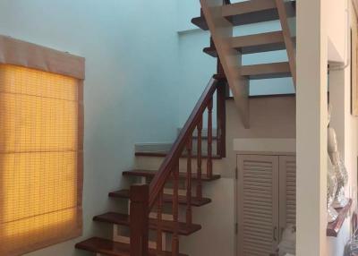 Wooden staircase in a well-lit home interior