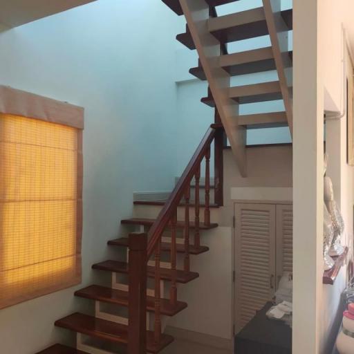 Wooden staircase in a well-lit home interior