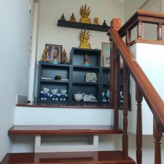 Wooden staircase with decorative shelving unit