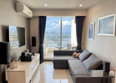 Modern living room with a city view through large windows