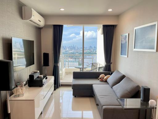 Modern living room with a city view through large windows