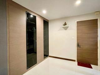 Modern hallway with wooden doors and clean design