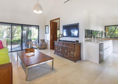 Spacious and bright living room with modern furniture and large windows