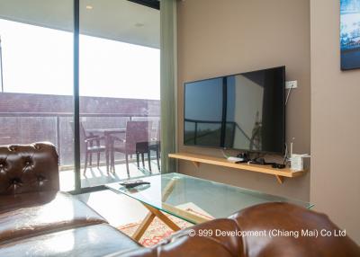 Modern living room with large windows and leather sofa