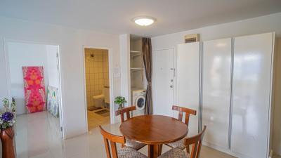 Brightly lit interior with dining area, adjoining bathroom, and laundry facilities