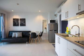 Modern open-plan living room with kitchen area