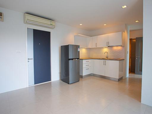 Modern kitchen with stainless steel appliances and white cabinets