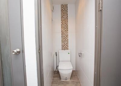 Modern bathroom with tiled flooring