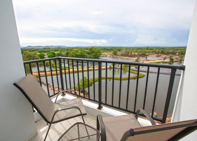 Spacious balcony with scenic view and seating arrangement