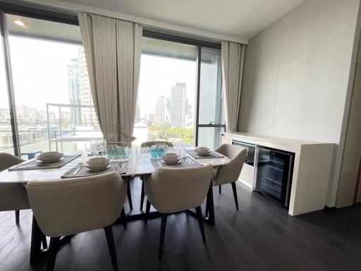 Modern dining room with natural light and city view