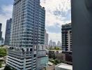 View of high-rise residential buildings under a blue sky with clouds