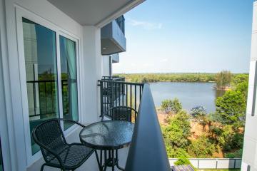 Balcony with outdoor furniture overlooking the water