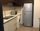 Compact modern kitchen with built-in appliances