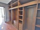 Spacious bedroom walk-in closet with custom shelving and storage solutions