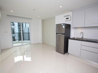 Modern kitchen with adjacent living area in an apartment