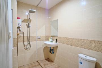 Modern tiled bathroom with shower and sink