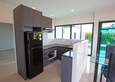 Modern kitchen with stainless steel appliances and island counter