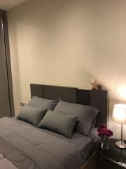 Cozy bedroom with double bed and side lamp