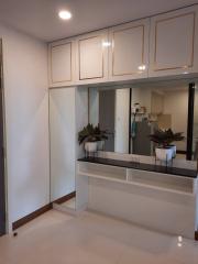 Spacious entrance hallway with built-in storage cabinets and modern design