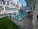 Private outdoor space with a small pool and laundry area, surrounded by residential buildings