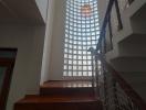 Staircase with natural light filtering through glass blocks