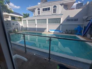 Swimming pool with a backyard view of the residential property