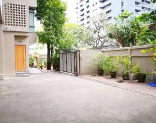 Spacious driveway leading to a residential building entrance