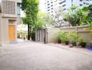Spacious driveway leading to a residential building entrance