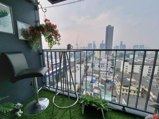 Cosy balcony with artificial grass overlooking the cityscape