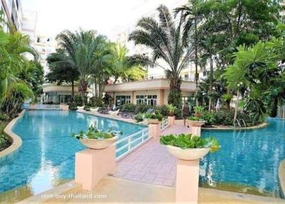 Residential complex with swimming pool and tropical landscaping