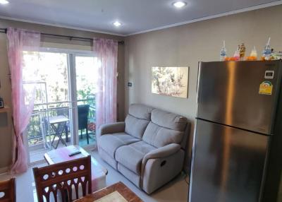 Cozy living room with modern furniture and balcony access