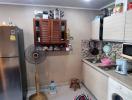 Modern kitchen with stainless steel appliances and a laundry area