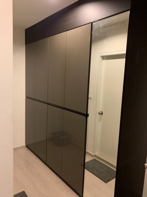 Modern bedroom with a large mirrored wardrobe