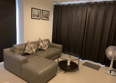 Modern living room with L-shaped sofa and elegant interior design