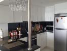 Modern kitchen with stainless steel appliances and white cabinetry