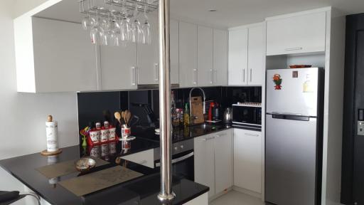 Modern kitchen with stainless steel appliances and white cabinetry