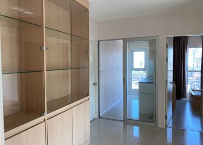 Spacious bedroom with built-in wardrobe and balcony access