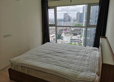 Cozy bedroom with a city view