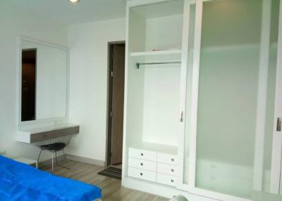 Spacious bedroom with built-in wardrobe and dressing area