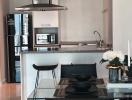 Modern kitchen with stainless steel appliances and breakfast bar