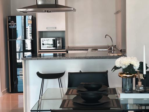 Modern kitchen with stainless steel appliances and breakfast bar