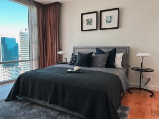 Modern bedroom with a view of the cityscape