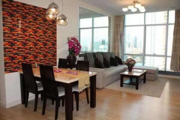 Modern living room with dining area and city view