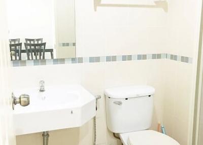 Clean white bathroom with modern amenities