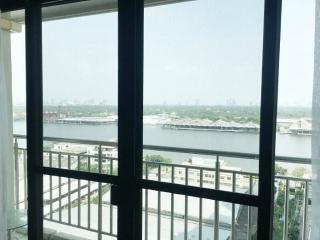 View from a window overlooking the river and cityscape