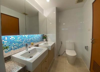 Contemporary bathroom with mosaic tiles and modern fixtures